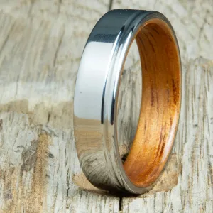 Polished titanium wedding band with Koa interior